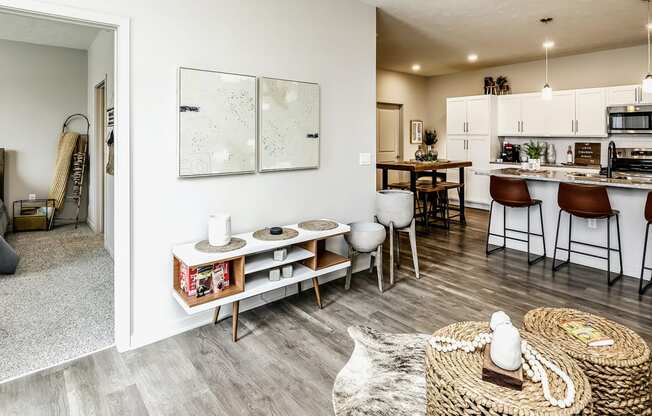 Living Room With Kitchen View at Tiburon Ridge, Omaha, NE