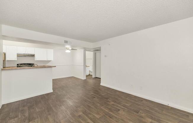 A room with wooden flooring and white walls at Urban WalkApartments on 6th Avenue, Phoenix, AZ