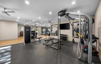 A well-equipped gym with a variety of exercise machines and equipment.