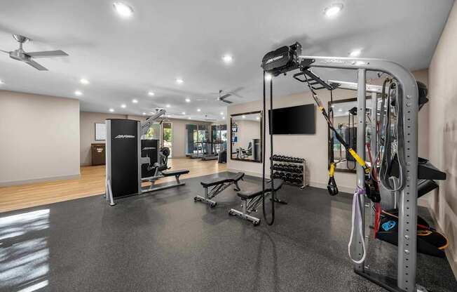 A well-equipped gym with a variety of exercise machines and equipment.