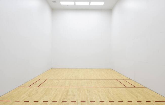 A squash court with a wooden floor and white walls at Esprit Marina del Rey, 90292