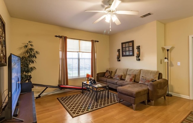 a living room with a couch and a tv