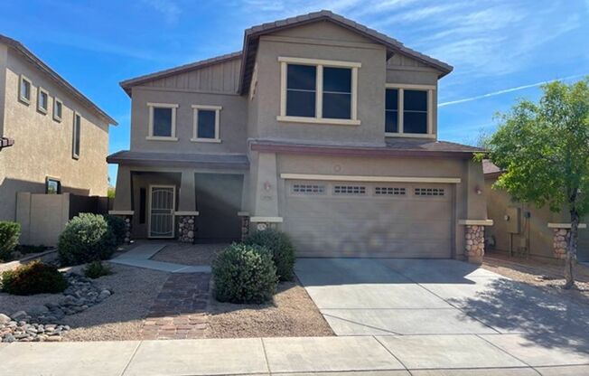 3 bedroom and 2 1/2 bath home with a pool and spa in Surprise Farms is ready for immediate move in!
