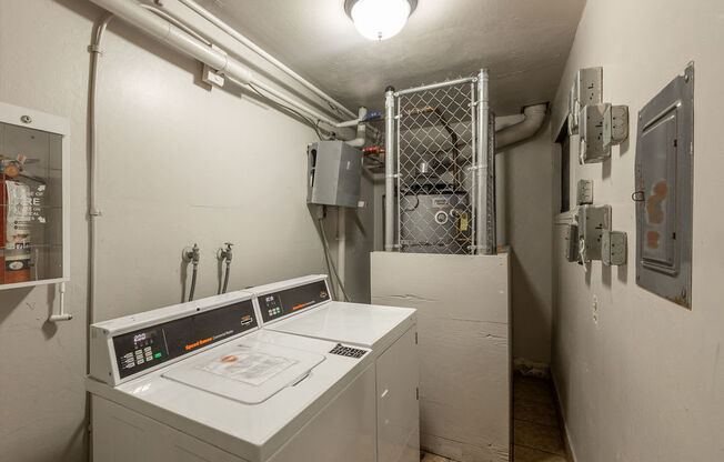 a white room with a washing machine in it