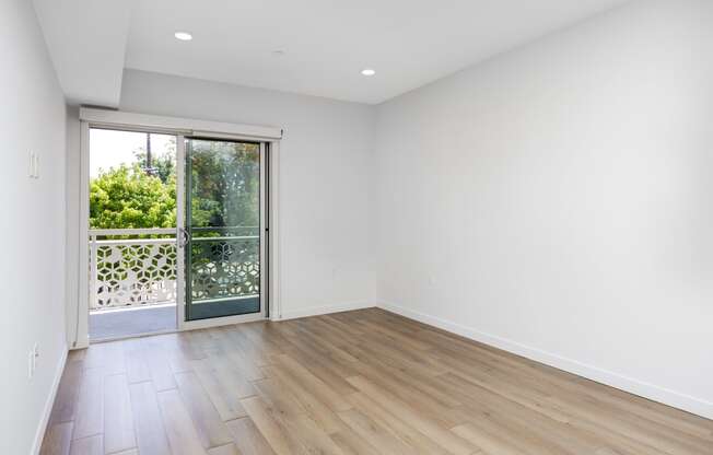 living room with a sliding glass door to a balcony