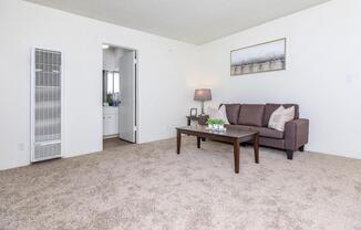 Living room with open bathroom door