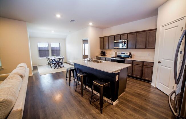 Boasts 4 bedrooms with 2 baths on a premier lot. As you enter the home, you will be greeted with an open entry way that leads to the open concept living room