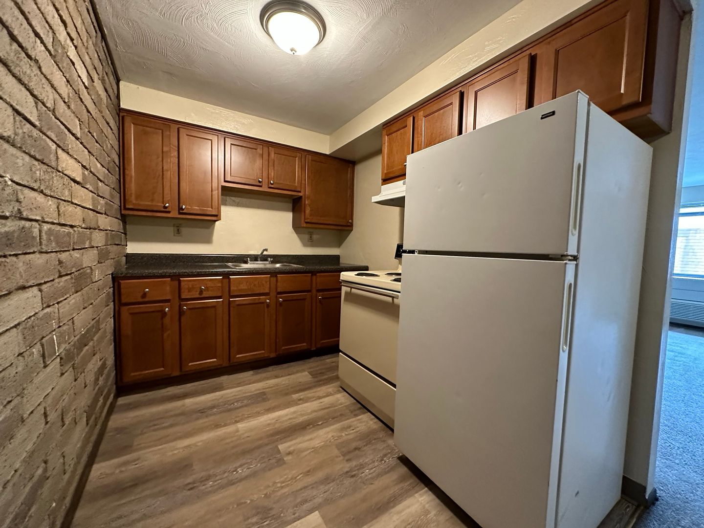 Cozy One Bedroom with Beautiful Exposed Brick! Off-Street Parking & Laundry Included!