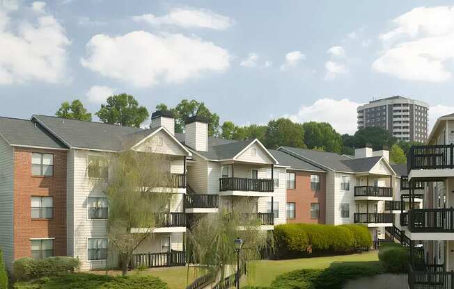 a rendering of an apartment building with a rainbow behind it