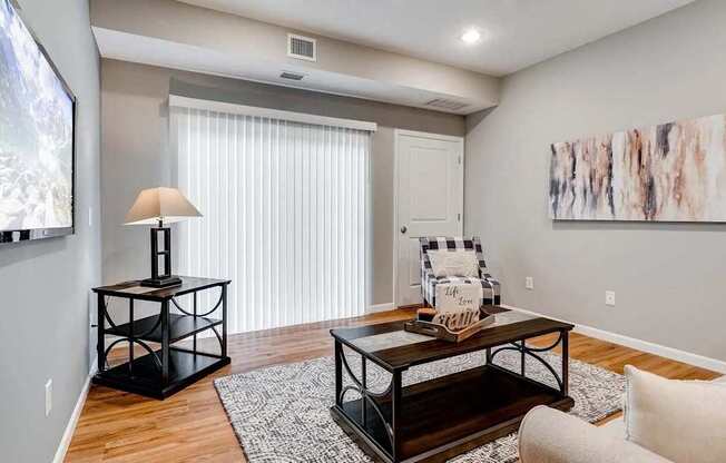 a living room with a couch and a table.  Circle Pines, MN Lexington Lofts