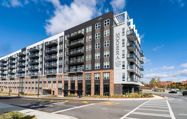 A corner view of Modera Westside Trail highlighting private balconies, layered materials, and a streetscape-focused design rooted in Atlanta’s Westside.