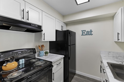 the enclave at homecoming terra vista kitchen  at Camelot Apartment Homes, Washington