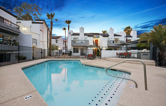 Community Swimming Pool with Pool Furniture at Crystal Creek Apartments in Phoenix, AZ.