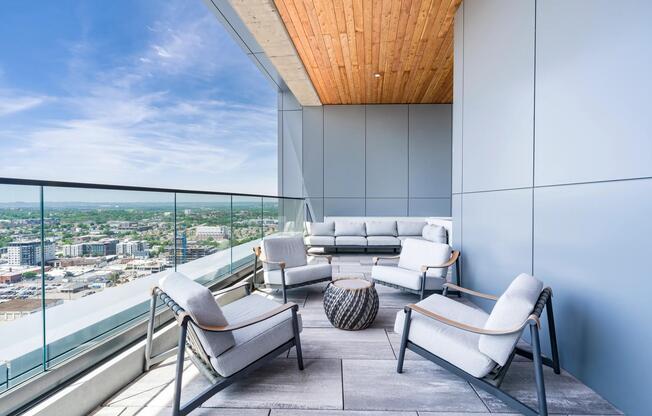 Rooftop terrace with skyline views, covered seating, and comfortable lounge furniture designed for conversation, fresh air, and Nashville views.
