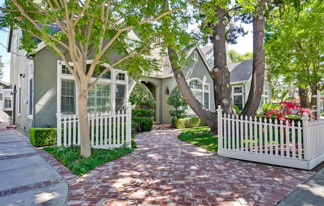 Stunning two-story spacious home on tranquil tree-lined street.