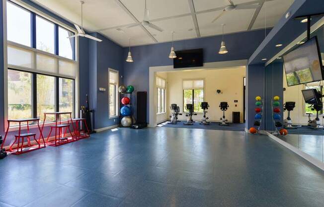 a room with a bunch of exercise equipment in it  at Cabana Club - Galleria Club, Jacksonville, FL, 32256