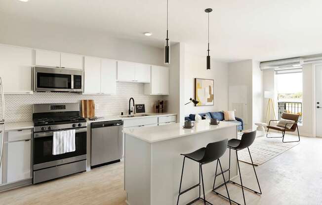 A modern kitchen with a white island and bar stools.