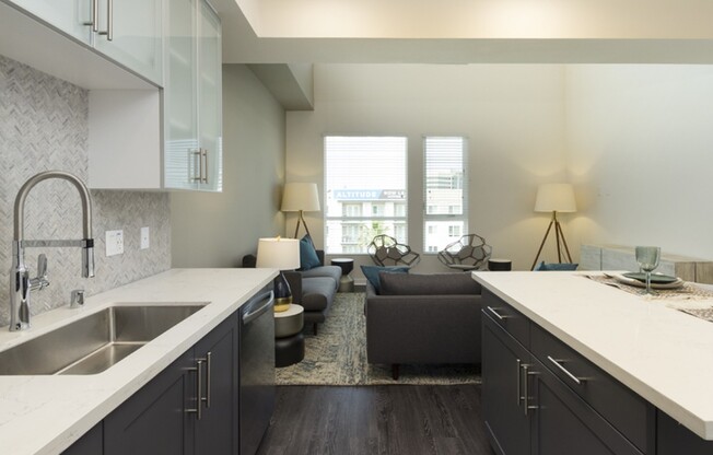 Expansive kitchens with custom cabinetry, tile backsplash and Moen faucets