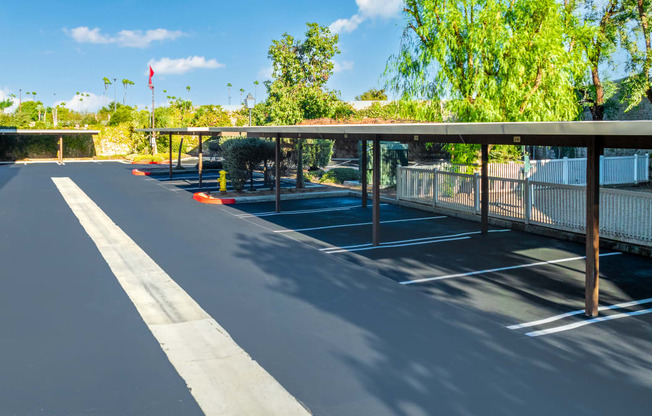 an empty parking lot with a covered parking lot