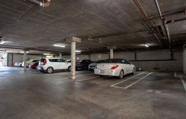 a parking garage with cars parked in it