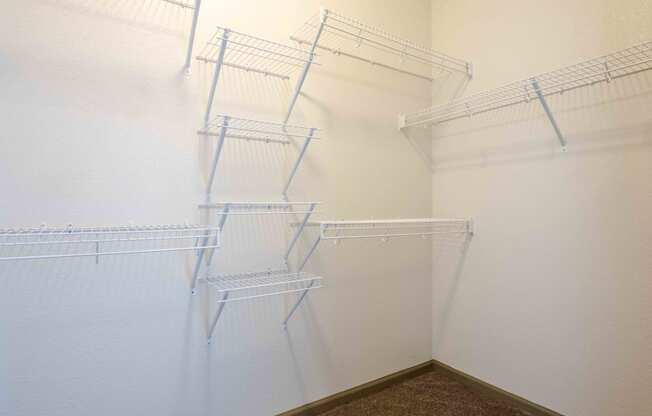 a walk in closet in a at Parc at Bentonville Apartments in Bentonville, AR