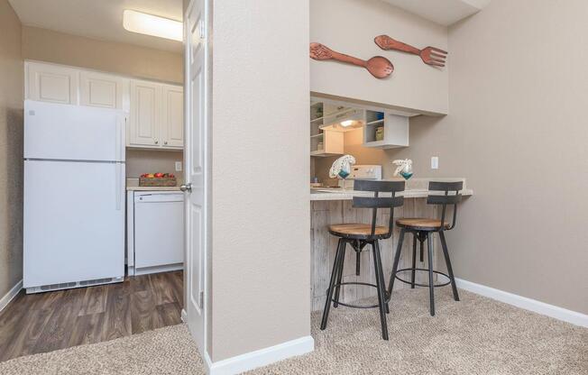 a white refrigerator freezer sitting inside of a kitchen