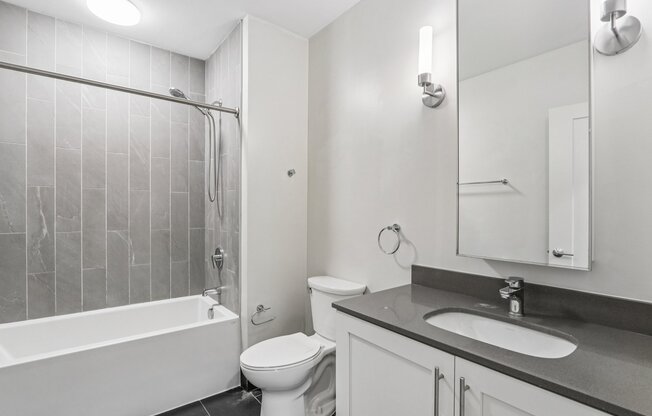 Bathroom with sink and bathtub at Park77 Apartments, Cambridge