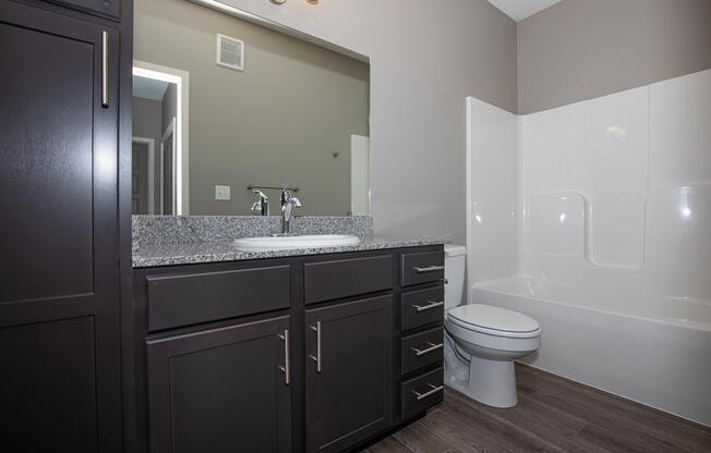 a kitchen with a sink and a refrigerator