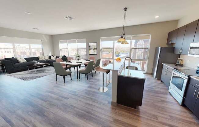 A modern kitchen with a dining table and chairs.