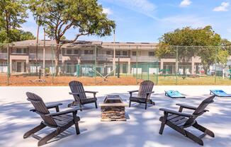 a group of lawn chairs sitting on top of a picnic table