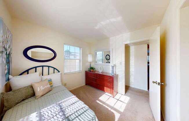 a bedroom with a window and walk-in closet