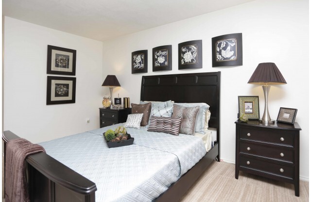 Master bedroom with queen bed and two nightstands
