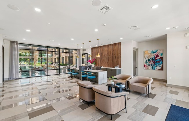 A spacious lobby with a reception desk and comfortable seating.