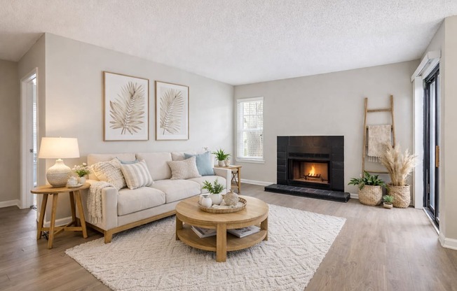 A living room with a fireplace and a couch.