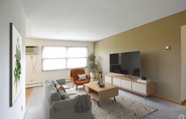 Spacious living room with large windows allowing sunlight in the room. A/C unit in the upper side of the wall next to the windows.