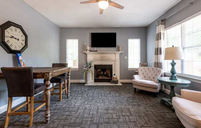 A living room with a fireplace and a television.