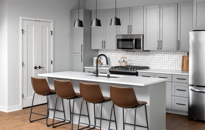 eat-in kitchen with designer fixtures and finishes in two bedroom apartment model