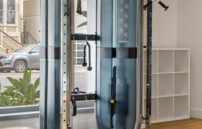 a gym with a pair of exercise machines in a home office