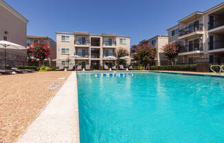 This is a photo of the pool area at The Summit at Midtown Apartments in Dallas, TX.