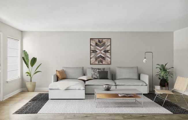 Model living room with light colored sofa