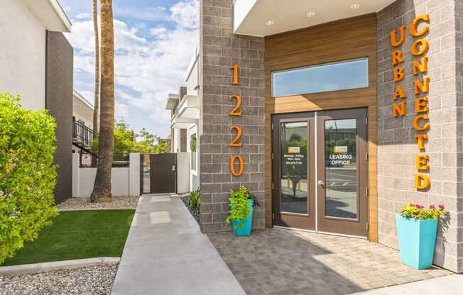 the facade of a condo building with the doors open