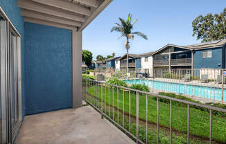 A view of a pool from a balcony.