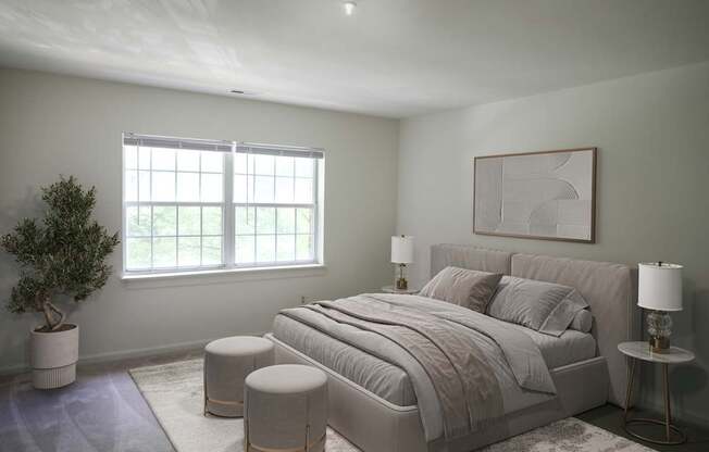 A bedroom with a large bed, a potted plant, and a framed artwork on the wall.