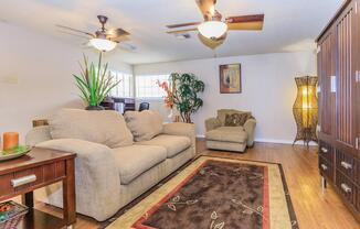 a living room filled with furniture and a fireplace
