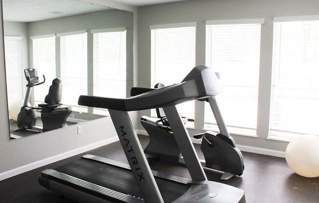 gym with a treadmill at apartment complex