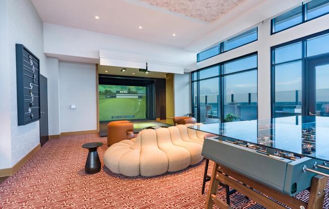 Soar to the 30th floor lounge with a golf simulator, game table, and floor-to-ceiling views.