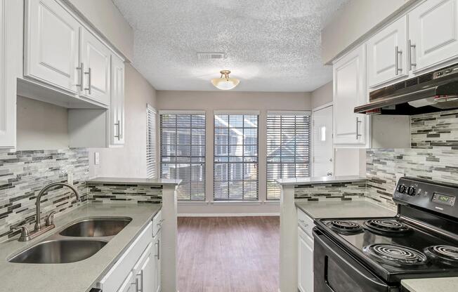 a kitchen with a stove top oven