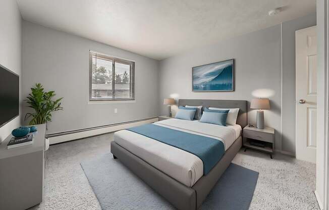 A bedroom with a large bed and a television.