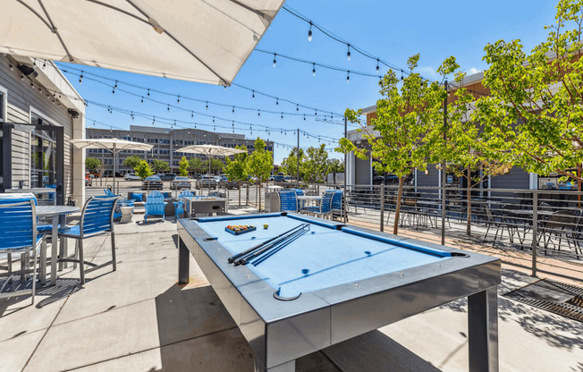 outdoor pool table on sunny patio
