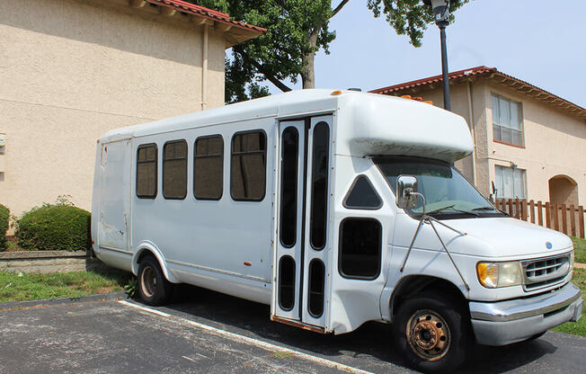 a white bus parked in a parking lot